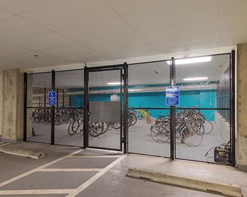 a group of bikes parked in a parking garage